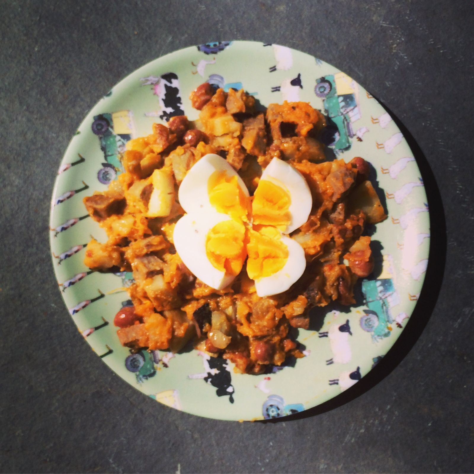 Sweet potato, bean & chorizo hash topped with an egg